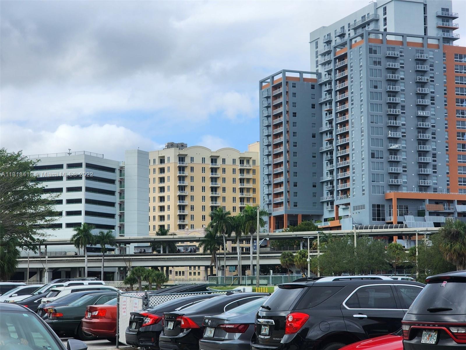 8600 Southwest 67th Avenue, Unit 906 Pinecrest, FL 33156 - Photo 27 of 27 a front view of a building with cars parked