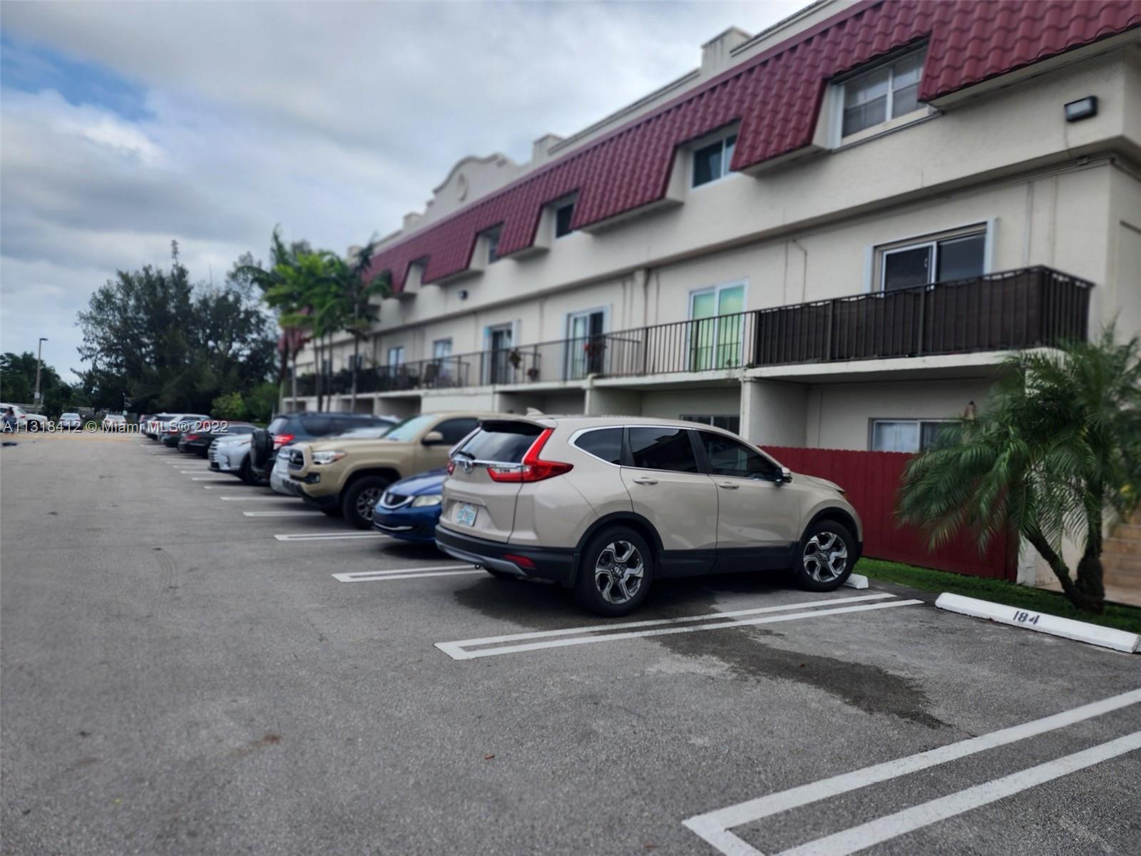 8600 Southwest 67th Avenue, Unit 906 Pinecrest, FL 33156 - Photo 4 of 27 a car parked in front of a building