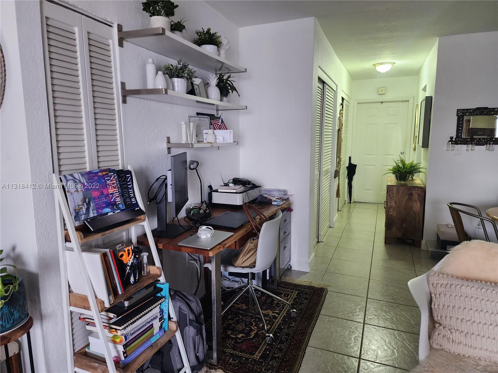 8600 Southwest 67th Avenue, Unit 906 Pinecrest, FL 33156 - Photo 9 of 27 a view of a workspace with furniture