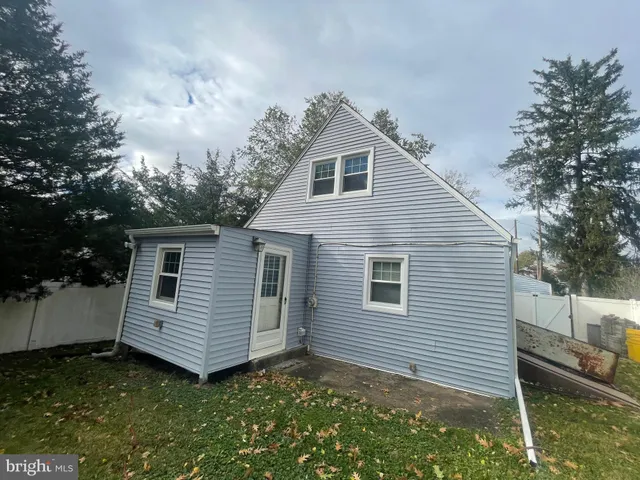 a view of a back yard of the house
