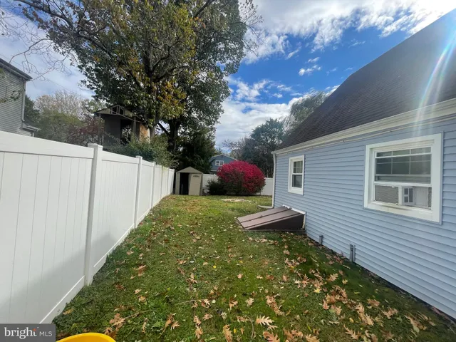 a backyard of a house with a tree