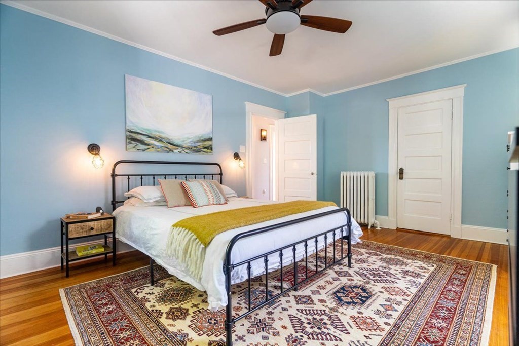 6 Malverna Road Boston, MA 02131 - Photo 12 of 29 a bedroom with a bed and wooden floor