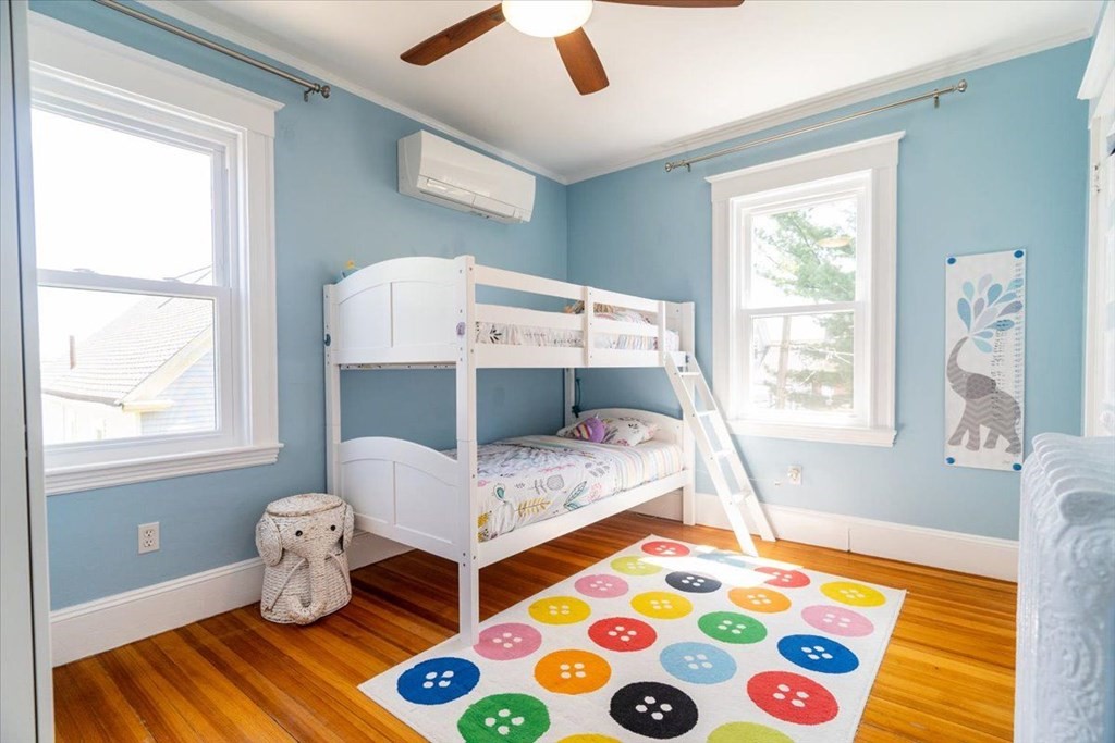 6 Malverna Road Boston, MA 02131 - Photo 13 of 29 a bedroom with a bed and a window