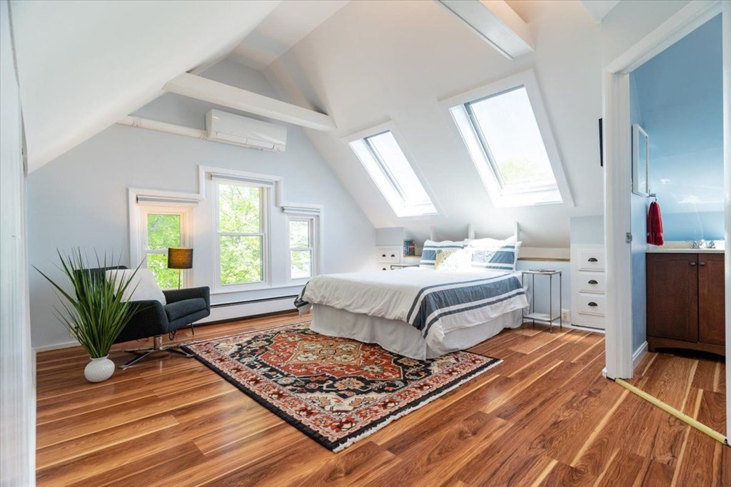 6 Malverna Road Boston, MA 02131 - Photo 18 of 29 a bedroom with a bed and wooden floor