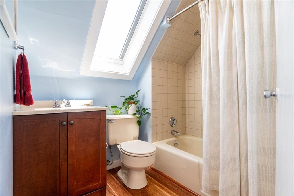 6 Malverna Road Boston, MA 02131 - Photo 19 of 29 a bathroom with a toilet and a bathtub