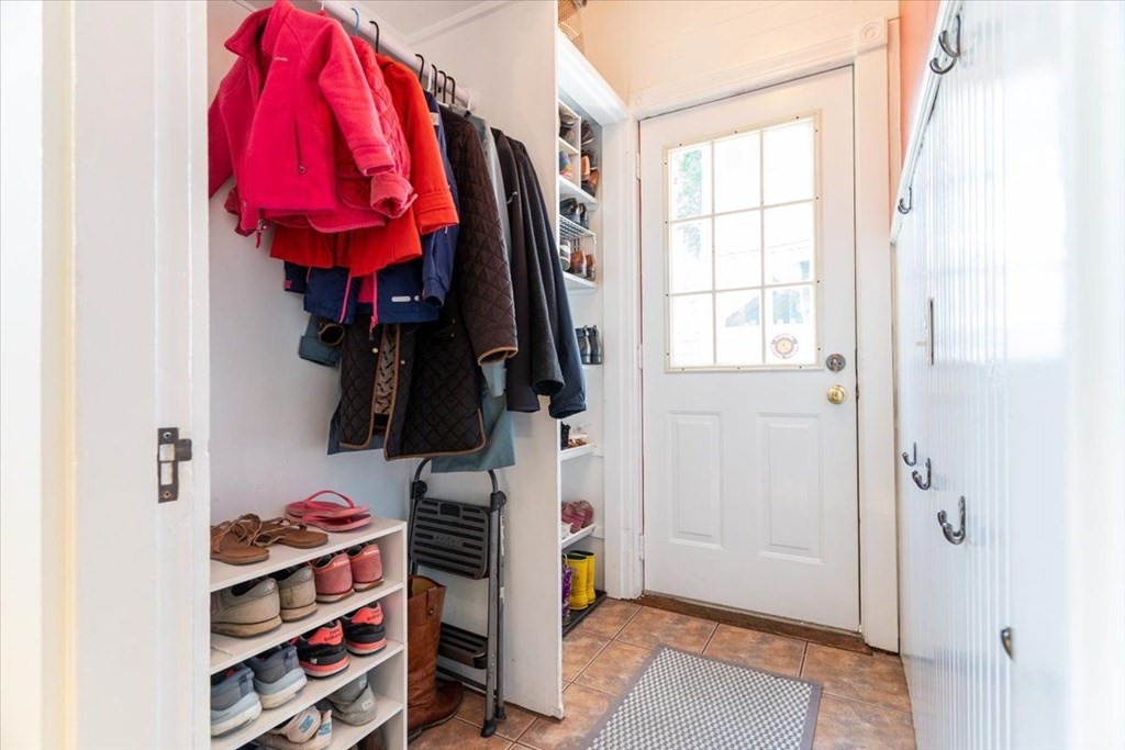 6 Malverna Road Boston, MA 02131 - Photo 21 of 29 a view of walk in closet with clothes and shoes