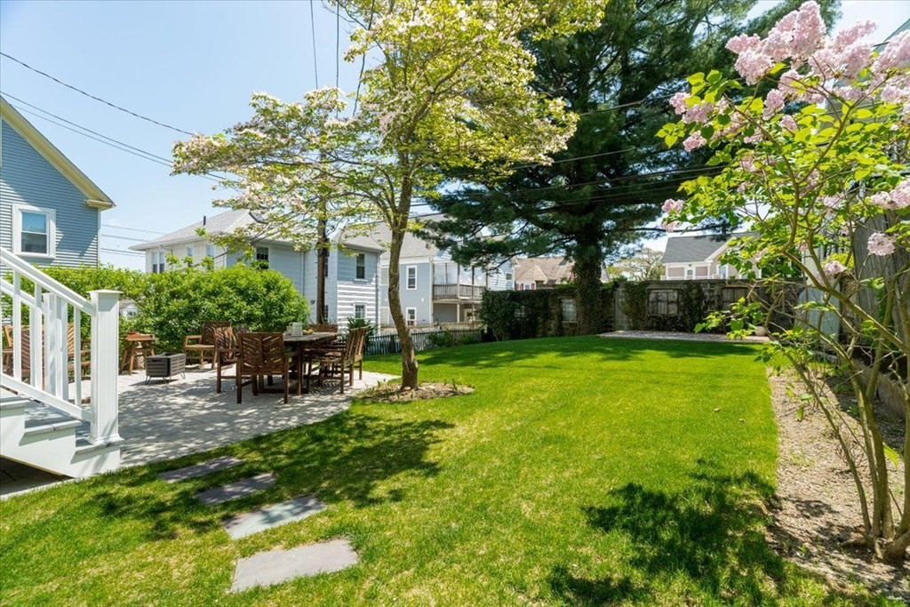 6 Malverna Road Boston, MA 02131 - Photo 23 of 29 a view of a house with backyard sitting area and garden