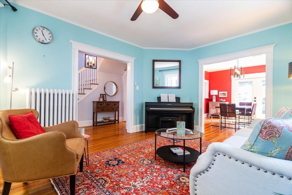 6 Malverna Road Boston, MA 02131 - Photo 8 of 29 a living room with furniture a fireplace and a floor to ceiling window