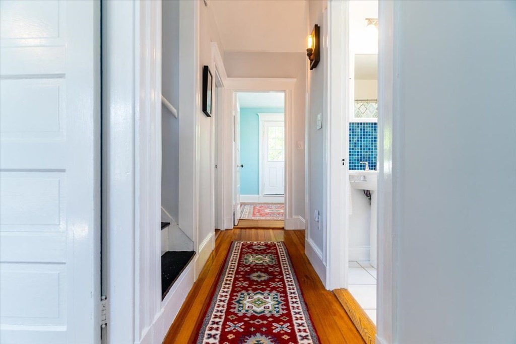 6 Malverna Road Boston, MA 02131 - Photo 10 of 29 a view of hallway with wooden floor