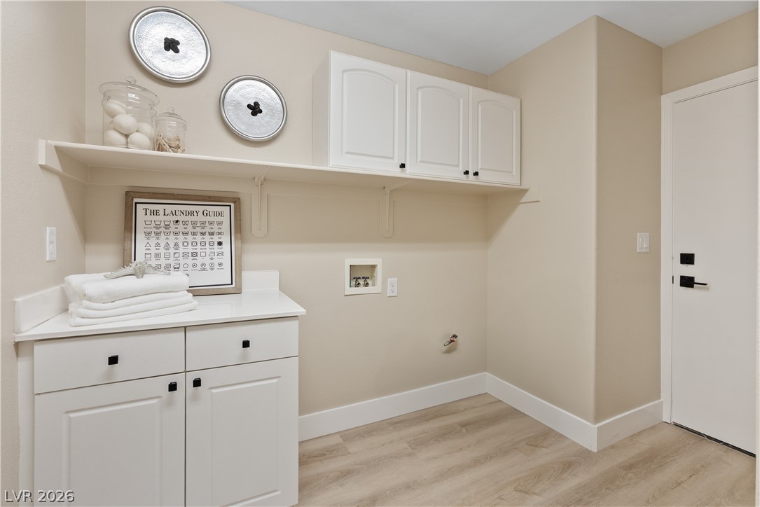 1662 Ravanusa Drive Henderson, NV 89052 - Photo 55 of 74 Ample cabinetry and shelving create a tidy and efficient space for household tasks.