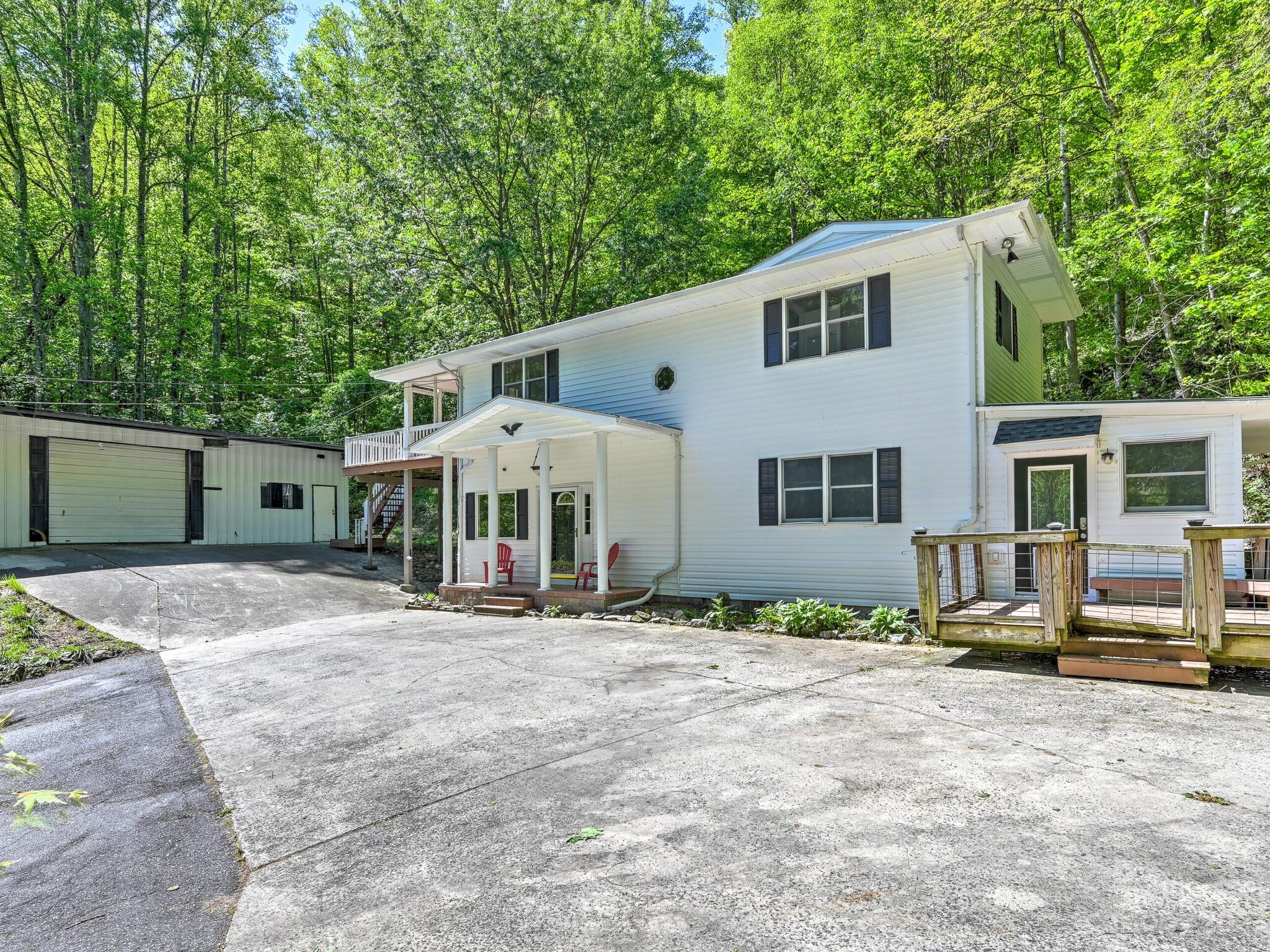 843 North Fork Road Barnardsville, NC 28709 - Photo 1 of 37 a front view of a house with garden