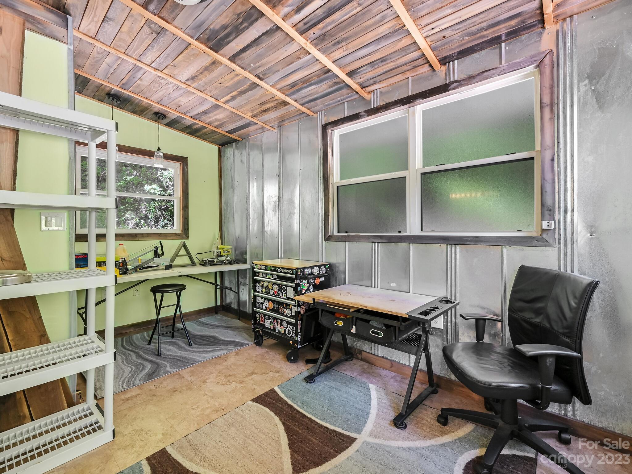 843 North Fork Road Barnardsville, NC 28709 - Photo 13 of 37 a view of a workspace with furniture and a window