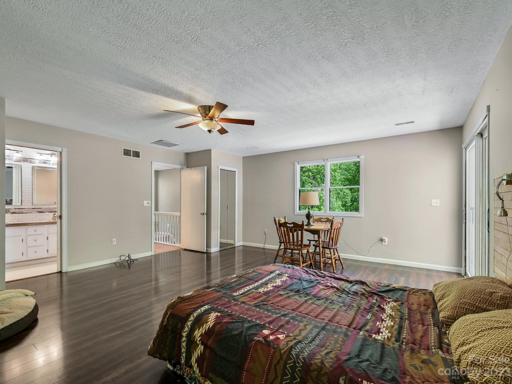 843 North Fork Road Barnardsville, NC 28709 - Photo 17 of 37 a bedroom with a bed and wooden floor