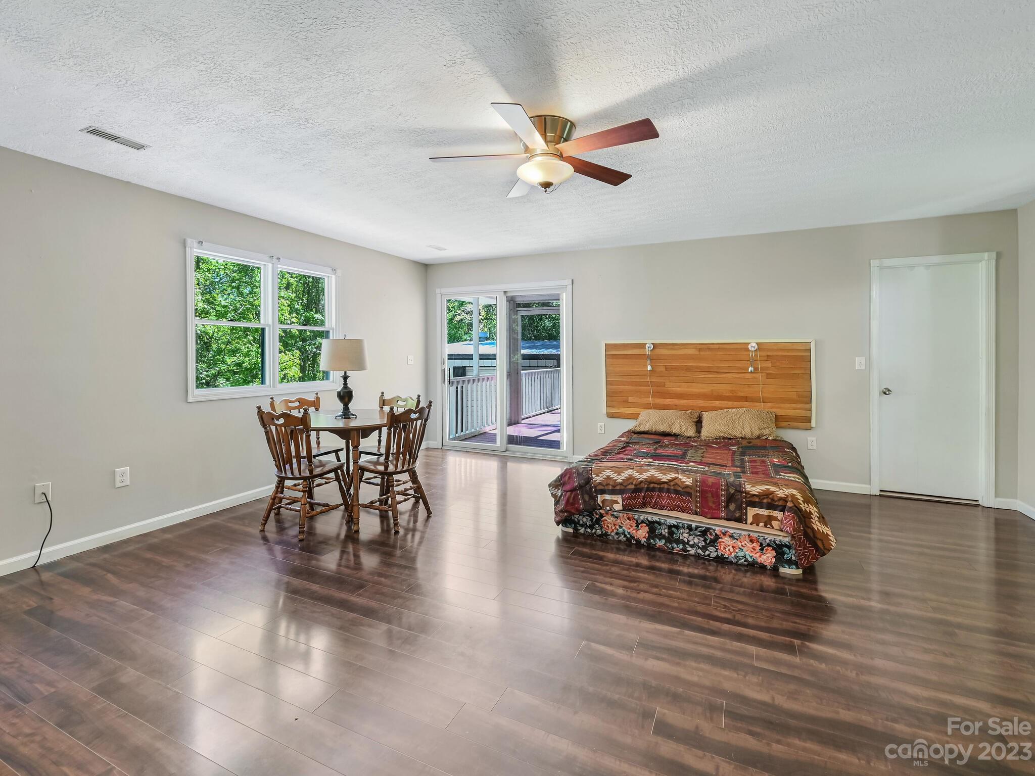 843 North Fork Road Barnardsville, NC 28709 - Photo 18 of 37 a bedroom with furniture and wooden floor