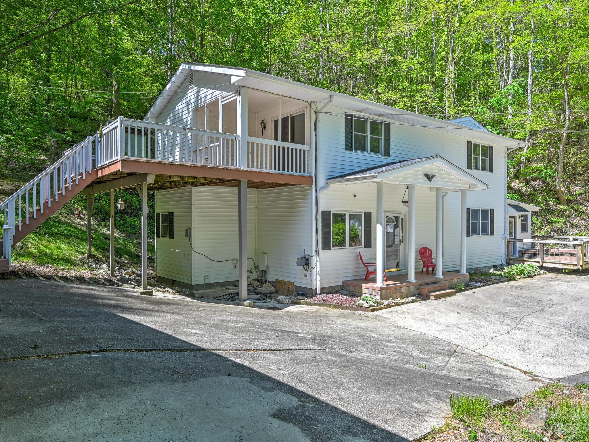 843 North Fork Road Barnardsville, NC 28709 - Photo 37 of 37 a front view of a house with a garden and trees