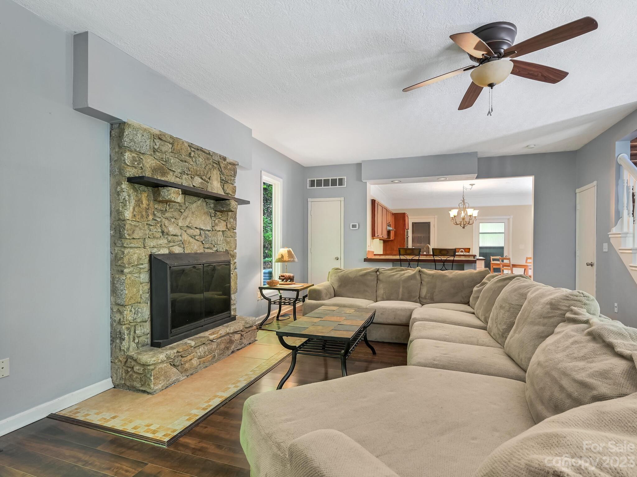 843 North Fork Road Barnardsville, NC 28709 - Photo 4 of 37 a living room with furniture and a fireplace