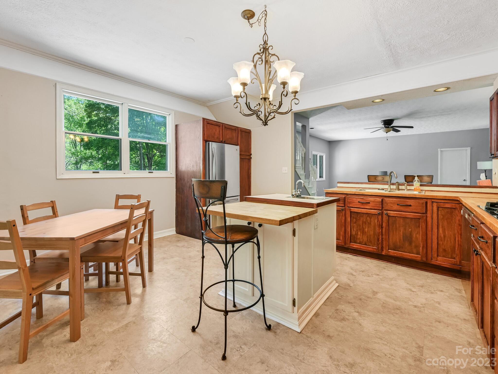 843 North Fork Road Barnardsville, NC 28709 - Photo 10 of 37 a large kitchen with a table and chairs in it