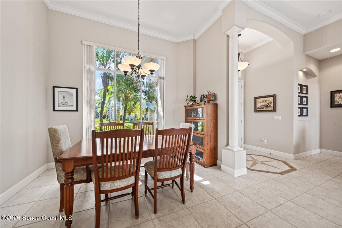 1050 Starling Way Rockledge, FL 32955 - Photo 11 of 59 a view of a dining room with furniture and a chandelier
