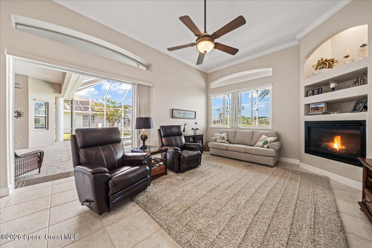 1050 Starling Way Rockledge, FL 32955 - Photo 17 of 59 a living room with furniture and a fireplace