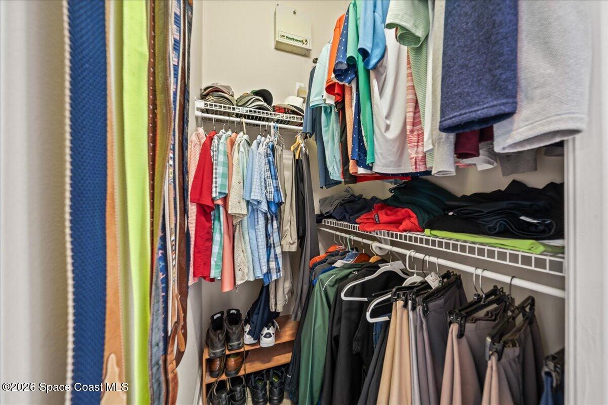 1050 Starling Way Rockledge, FL 32955 - Photo 25 of 59 a view of walk in closet with clothes