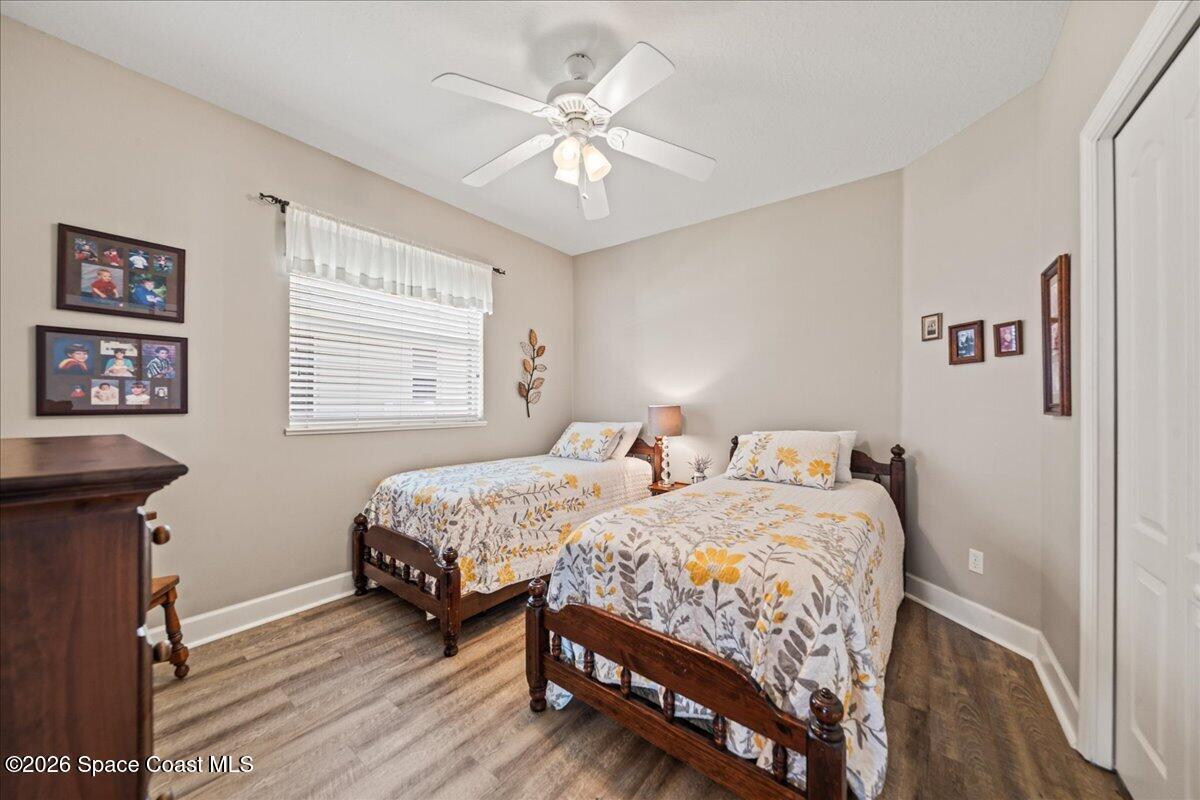 1050 Starling Way Rockledge, FL 32955 - Photo 26 of 59 a bedroom with two beds and a table