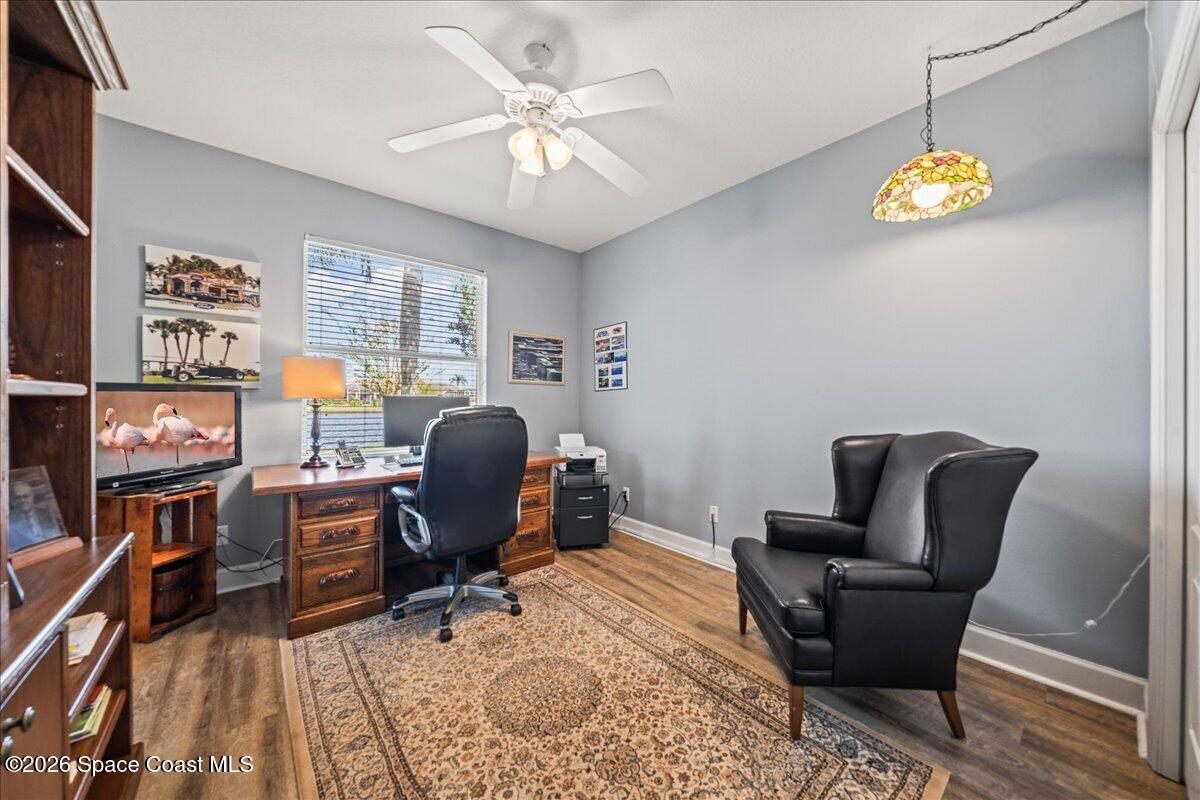 1050 Starling Way Rockledge, FL 32955 - Photo 29 of 59 a view of a workspace with furniture and a window