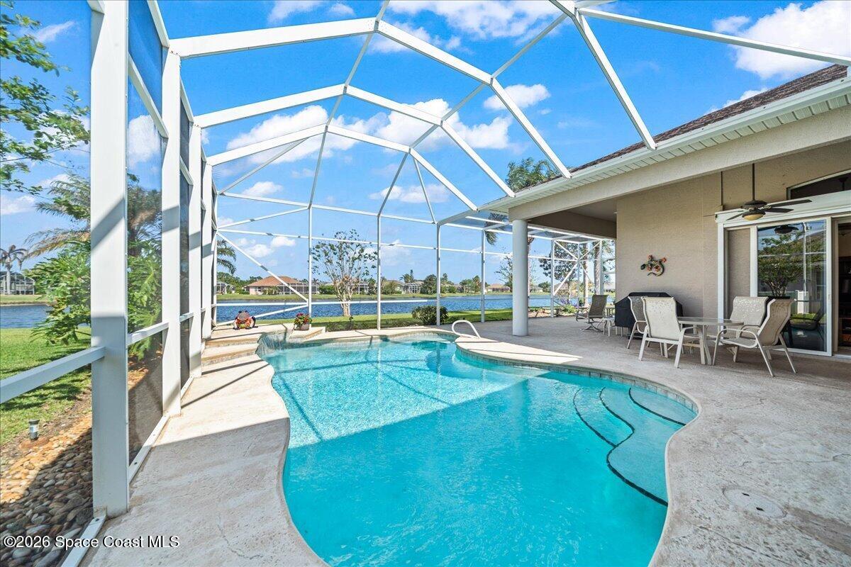 1050 Starling Way Rockledge, FL 32955 - Photo 3 of 59 a view of a swimming pool with outdoor seating