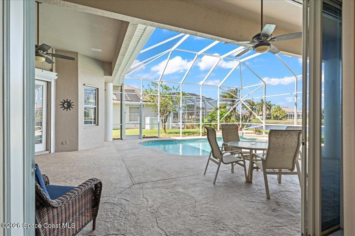 1050 Starling Way Rockledge, FL 32955 - Photo 32 of 59 a view of a dining room with furniture and chandelier