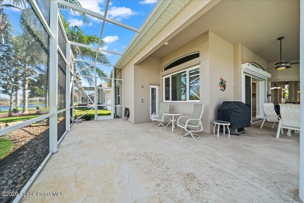 1050 Starling Way Rockledge, FL 32955 - Photo 36 of 59 a living room filled with furniture and a table