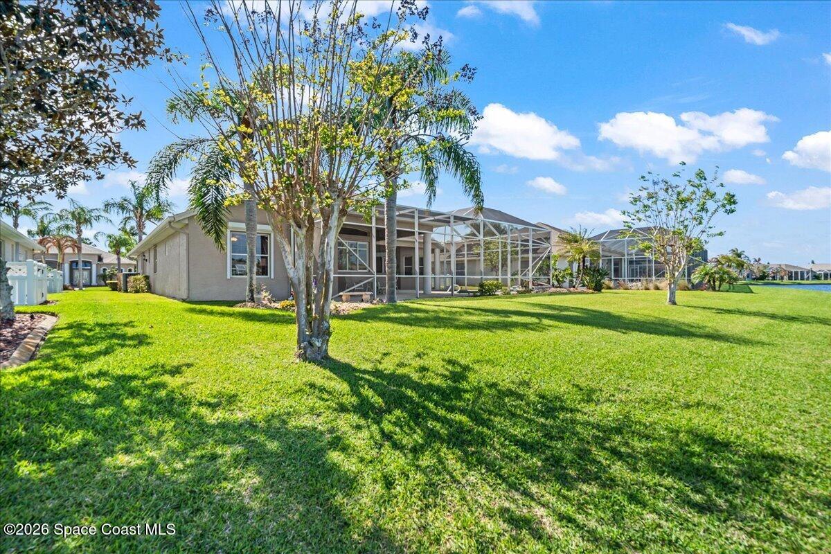 1050 Starling Way Rockledge, FL 32955 - Photo 47 of 59 a view of a house with a big yard