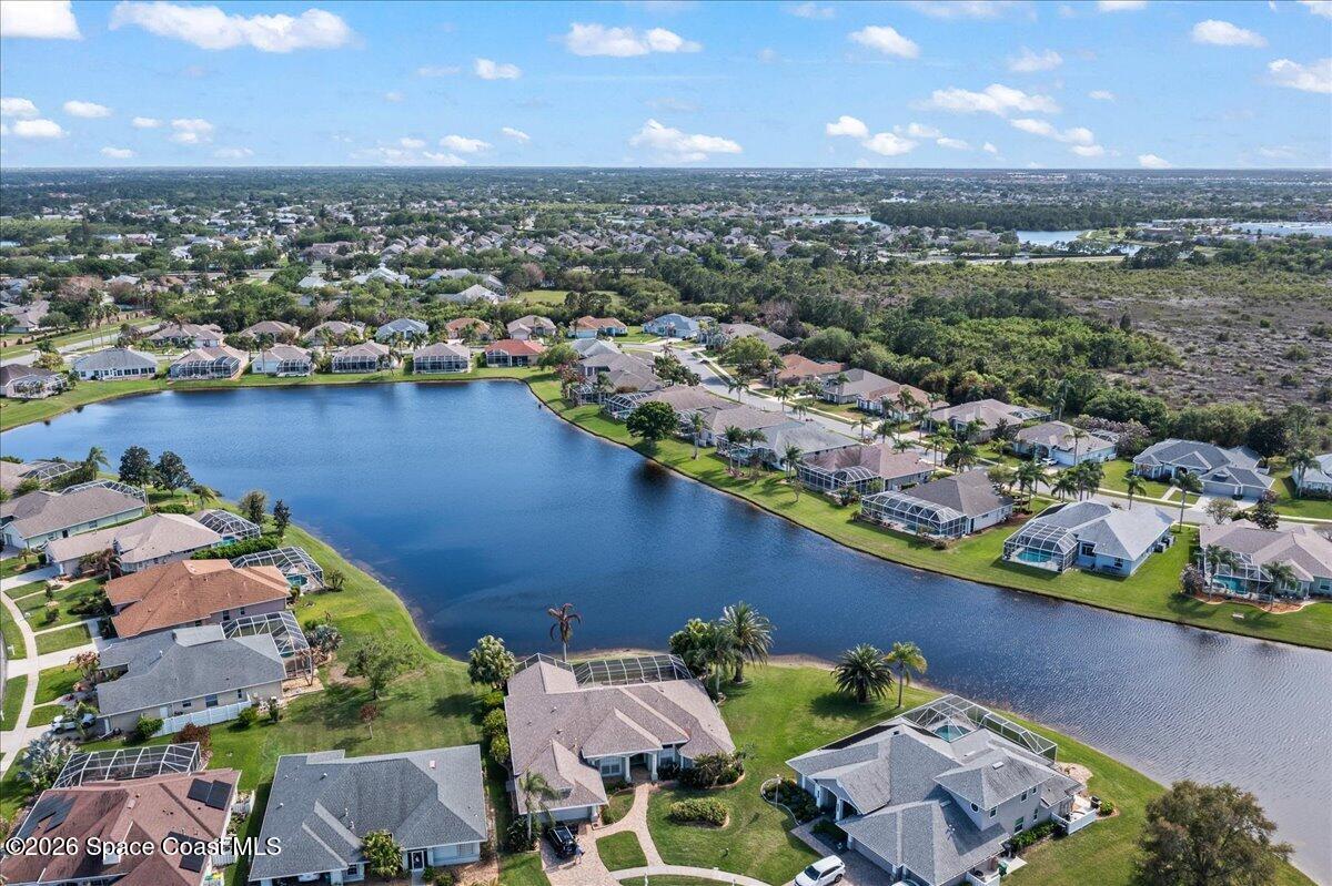 1050 Starling Way Rockledge, FL 32955 - Photo 51 of 59 an aerial view of a house with a lake