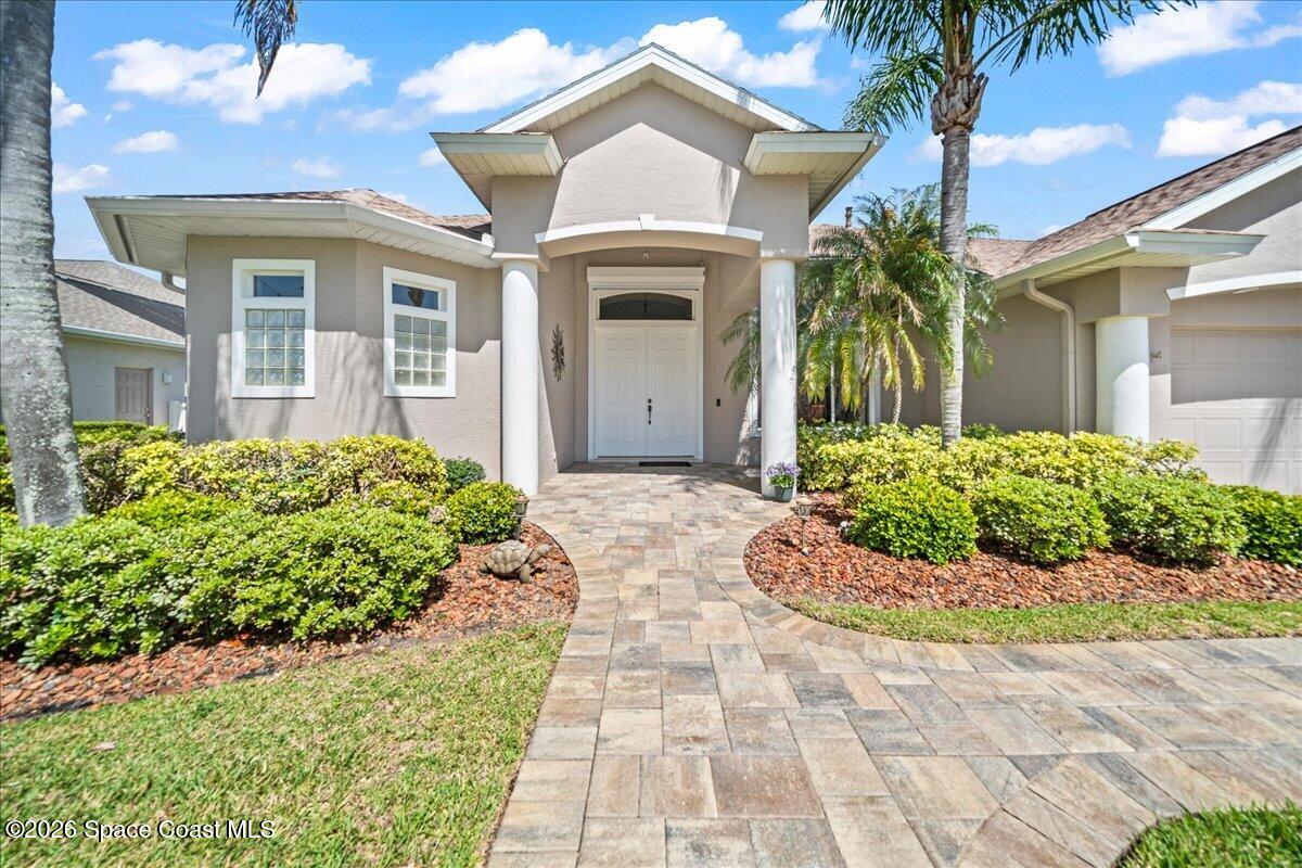 1050 Starling Way Rockledge, FL 32955 - Photo 7 of 59 a front view of a house with a garden