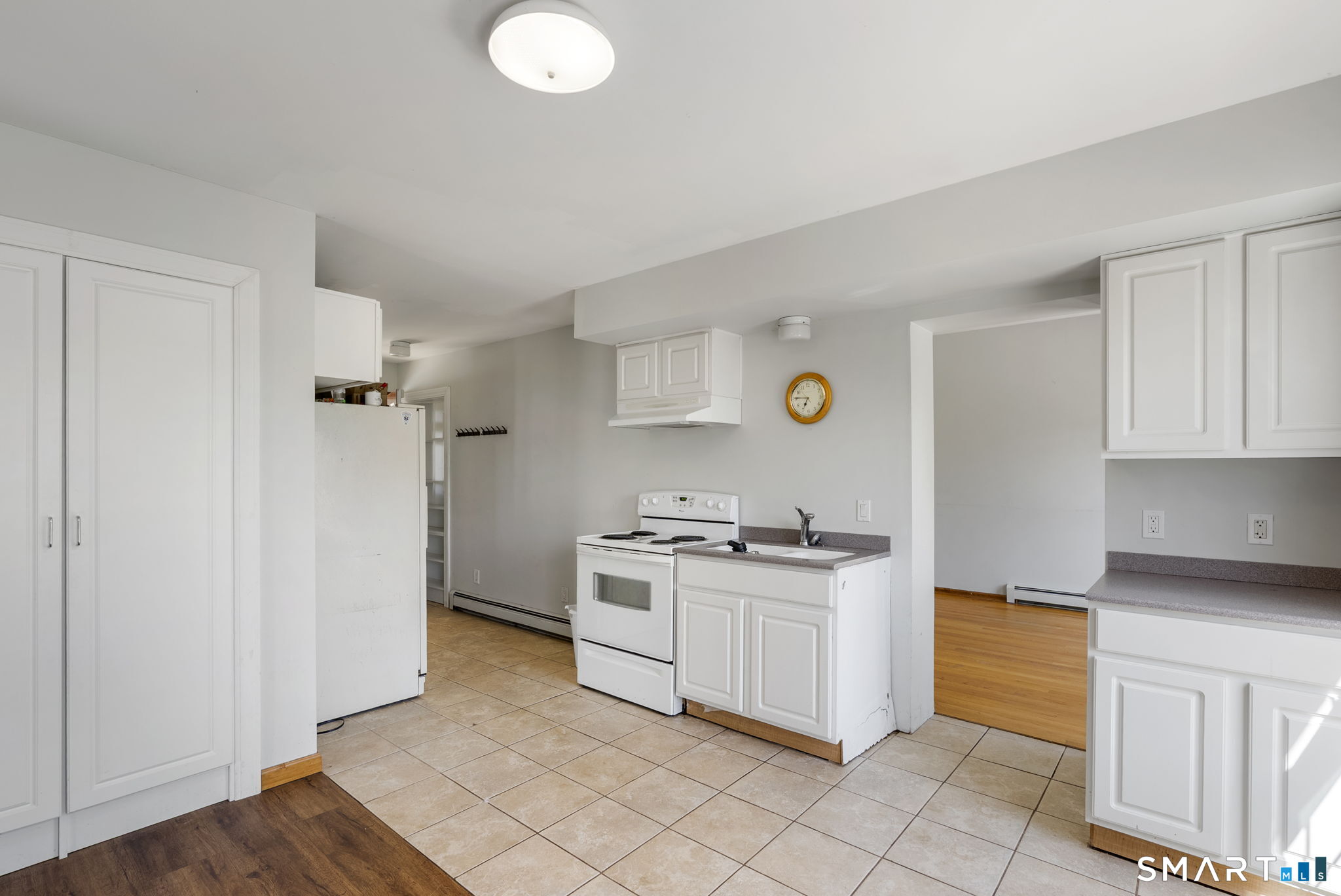 341 High Street Extension Thomaston, CT 06787 - Photo 27 of 39 a kitchen with stainless steel appliances granite countertop a stove a sink and a refrigerator