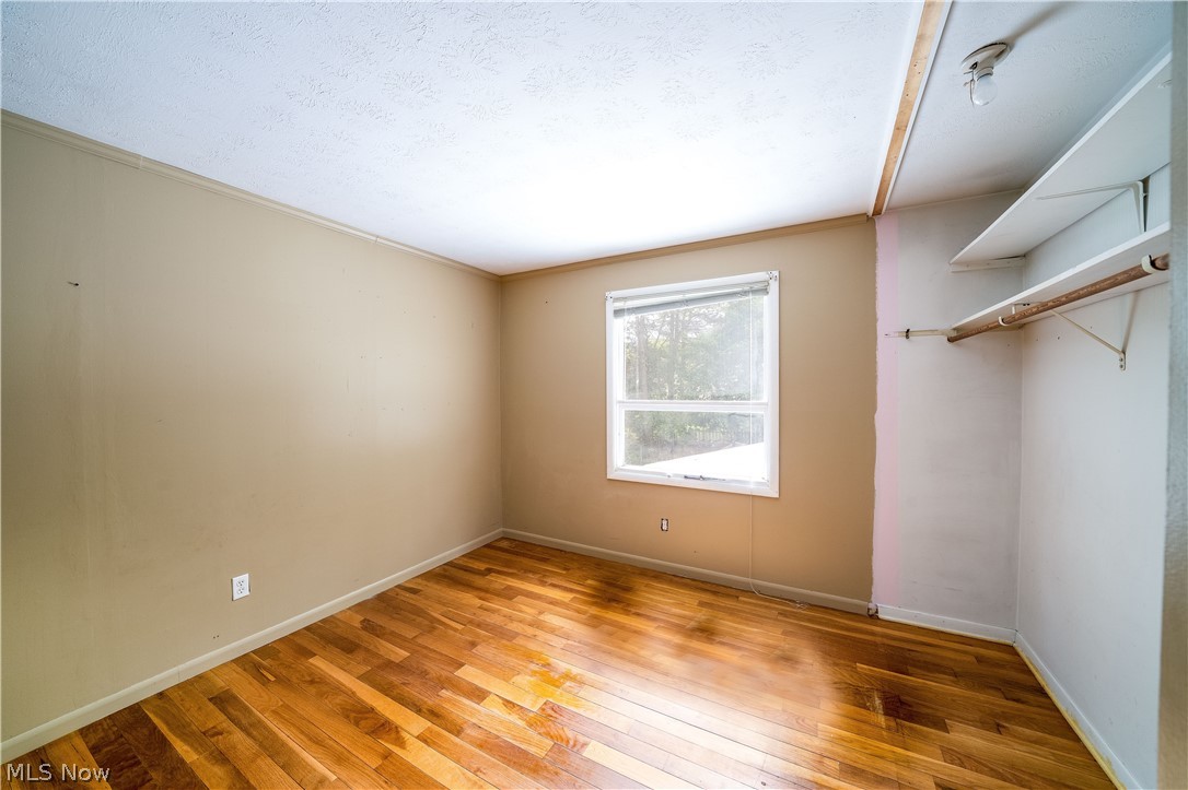 3754 Vira Road Stow, OH 44224 - Photo 21 of 35 3754 Vira Rd, Stow, OH 44224 won't last long! 4 Bedrooms & full bath on the 2nd floor as well as half bath on the 1st floor, separate Living Room, Family Room with beautiful Fireplace, gorgeous Sunroom with sliding doors to the huge deck with fenced rear yard & tool shed, Kitchen & Dining Room with wood floors; Full basement with half finished for recreation Room & other half as workshop & Hobby area as well as Laundry Hookups & Utilities.
