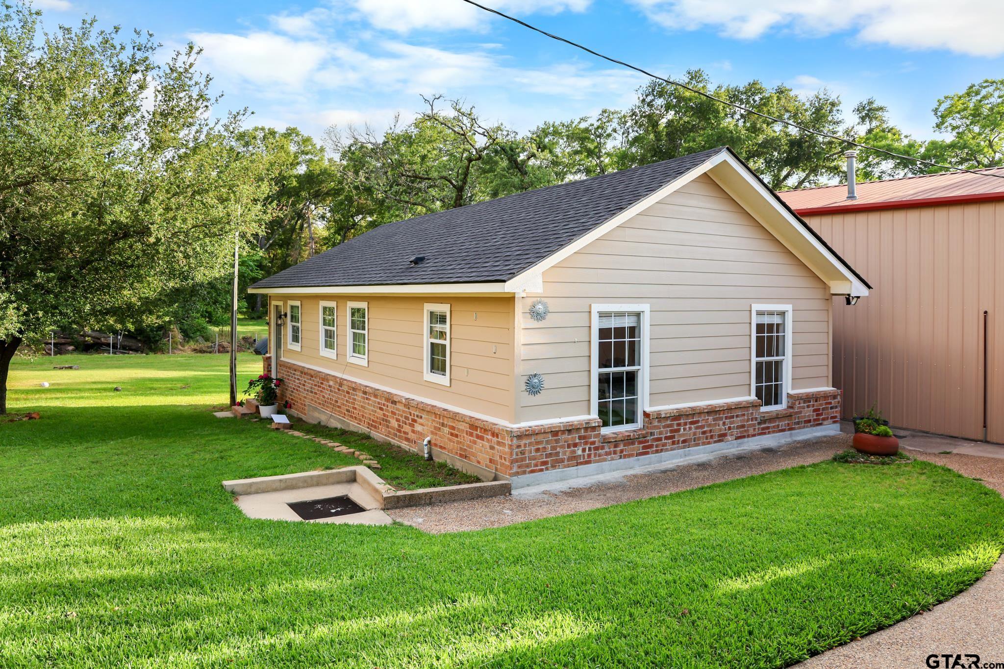 11931 State Highway 64 Tyler, TX 75704 - Photo 31 of 44 a view of a house with a yard and sitting area