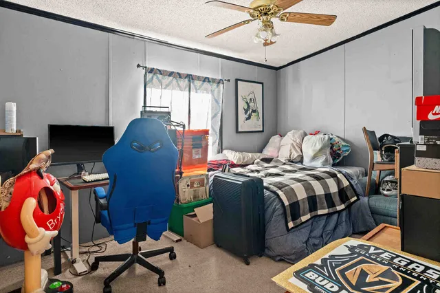 a bedroom with bed and a window