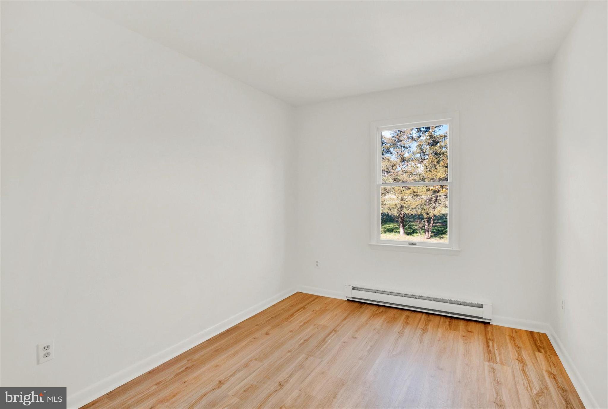 5400 Curley Hill Road Doylestown, PA 18902 - Photo 13 of 47 a view of a room with wooden floor and a window