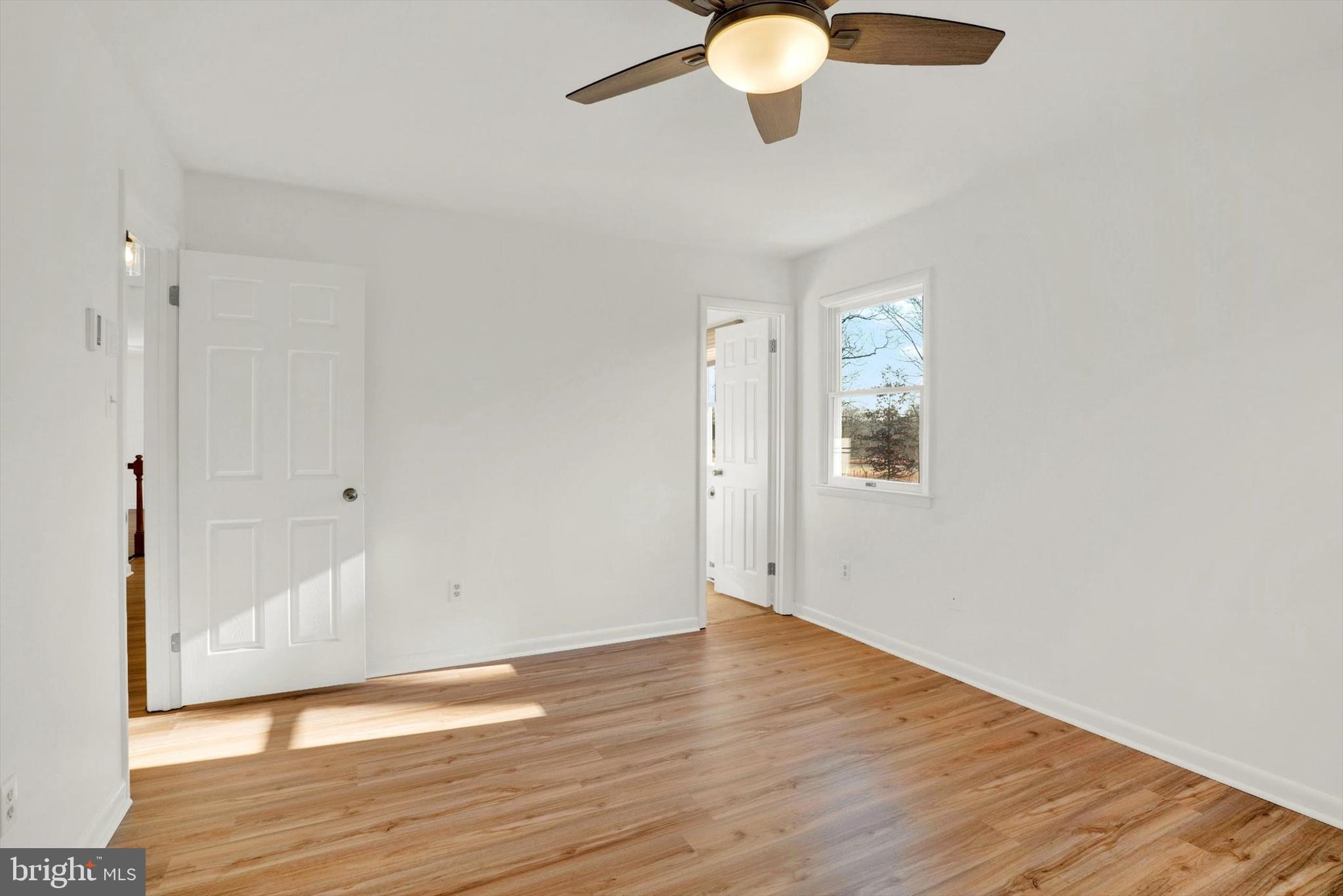5400 Curley Hill Road Doylestown, PA 18902 - Photo 15 of 47 a view of an empty room with wooden floor and a window