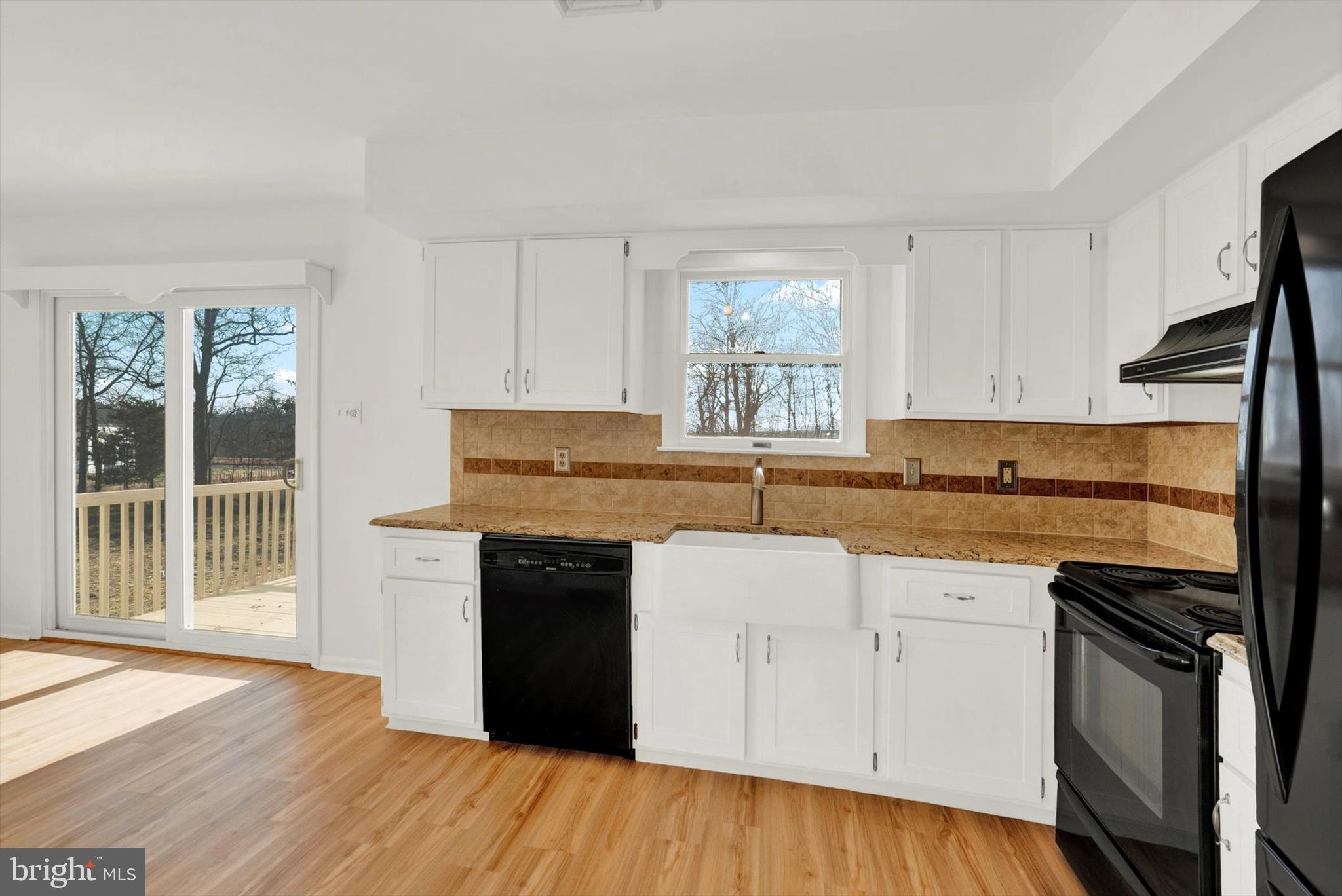 5400 Curley Hill Road Doylestown, PA 18902 - Photo 6 of 47 a kitchen with granite countertop a stove a sink and a refrigerator