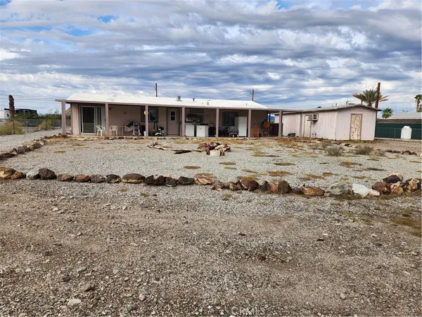 a view of a chairs and table in patio