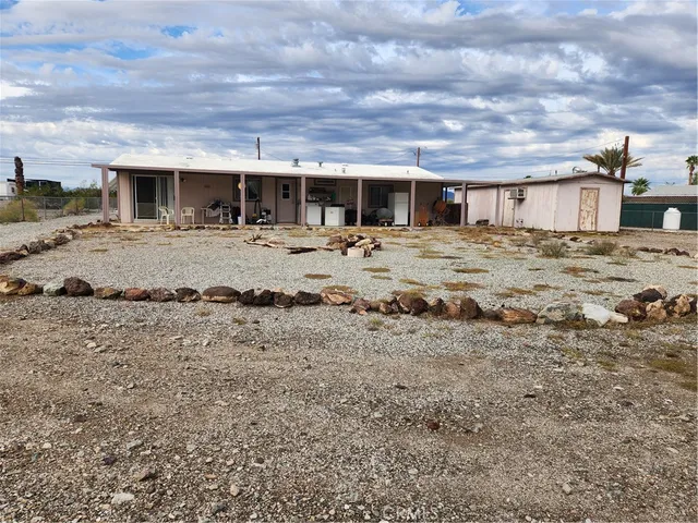 a view of a chairs and table in patio