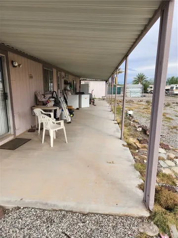 a kitchen with furniture and a fireplace