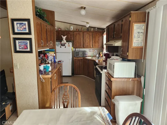 a room with wooden furniture and a window