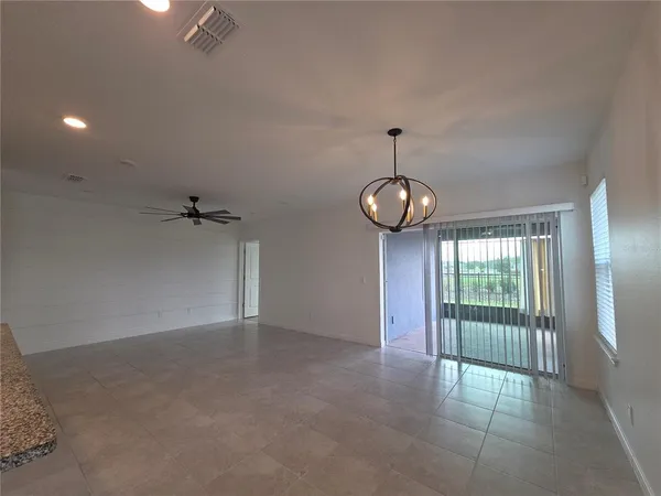 an empty room with closet and a flat screen tv