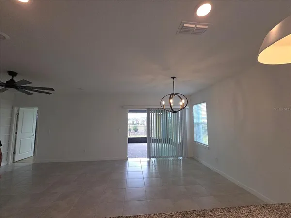 a kitchen with a refrigerator and a sink