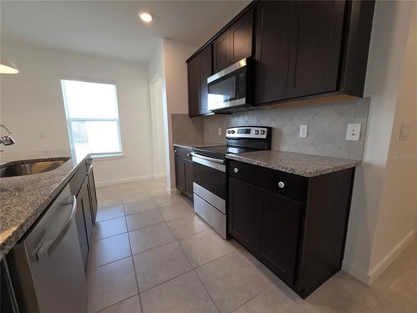 a bathroom with a sink a light fixture and a light fixture
