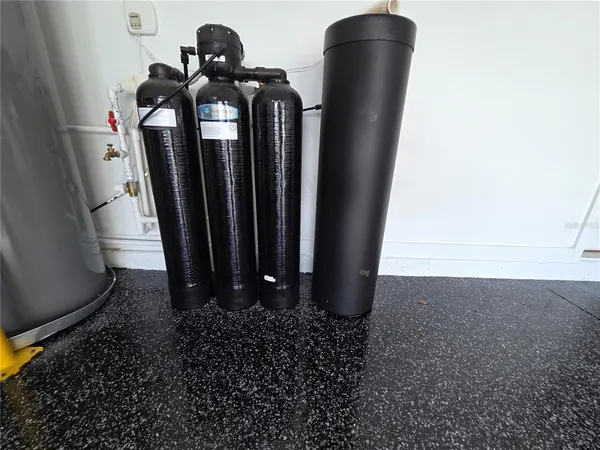 a dining room with furniture a chandelier and fireplace