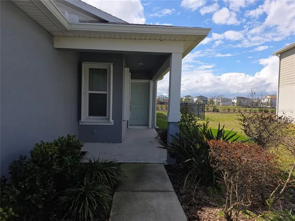 a backyard of a house with lots of green space