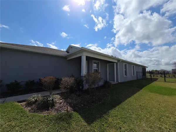 a view of a backyard of the house