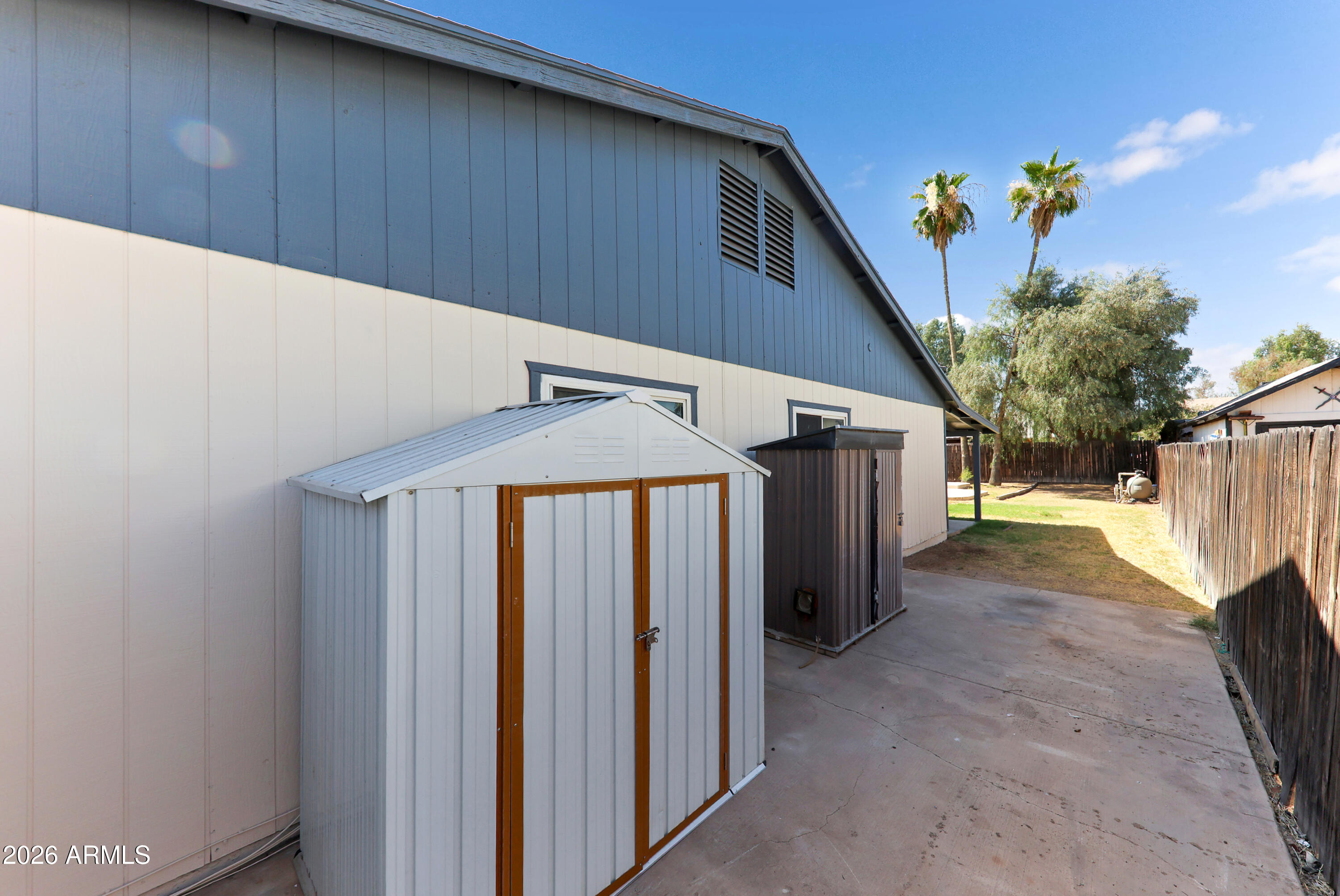 4723 East Vineyard Road Phoenix, AZ 85042 - Photo 26 of 27 a view of a house with a backyard